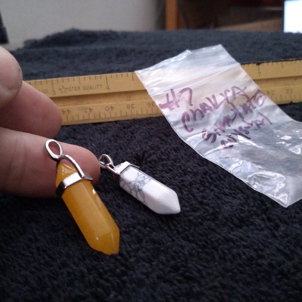 Orange and white simulated Chakra gemstone pendat pair in silver tone clip.